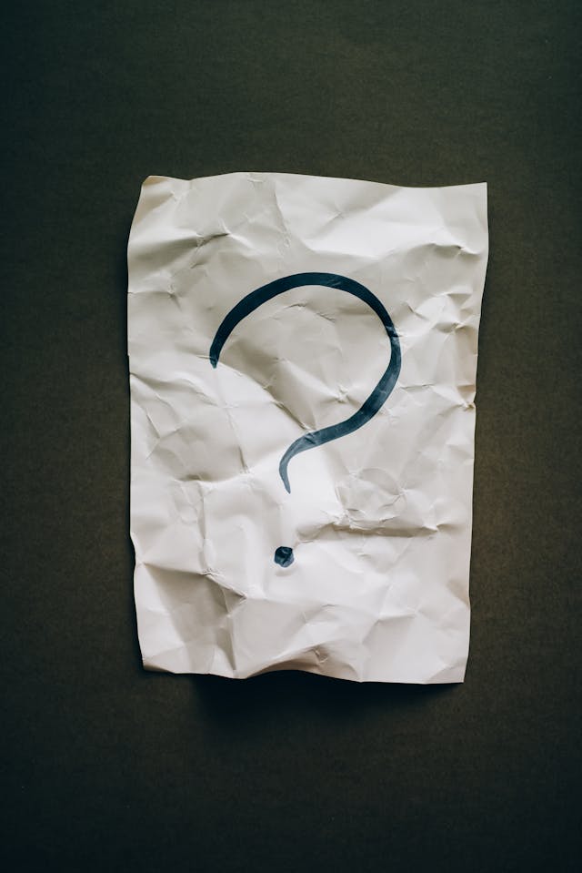 A question mark on crumpled paper