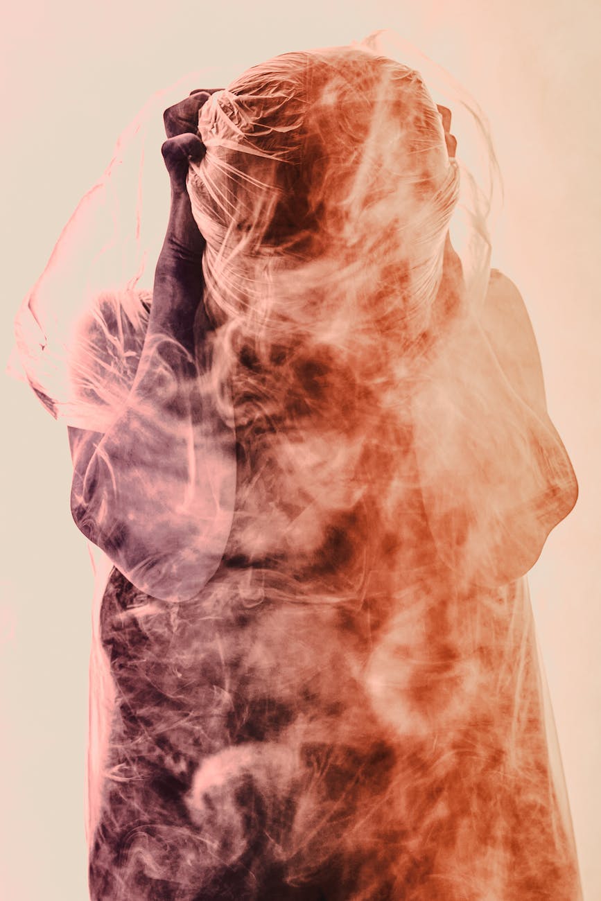 A person shrouded in mist, giving off vibes of being stressed and overwhelmed.